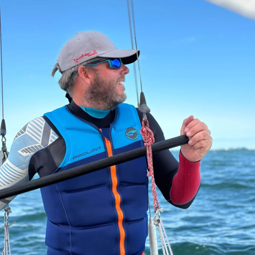 Sailing man wearing a cap and sunglasses