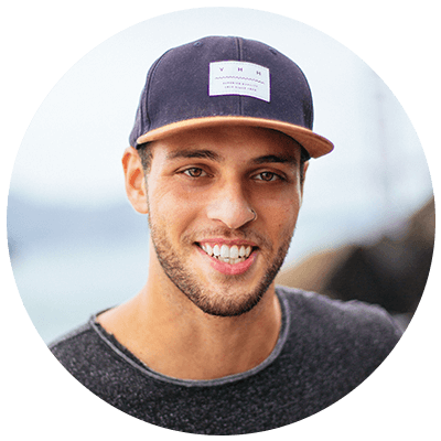 Smiling young man wearing a cap